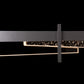 Hubbardton Forge Tenon LED Pendant in black metal and glass, showcasing rectangular shapes with bubble detailing.