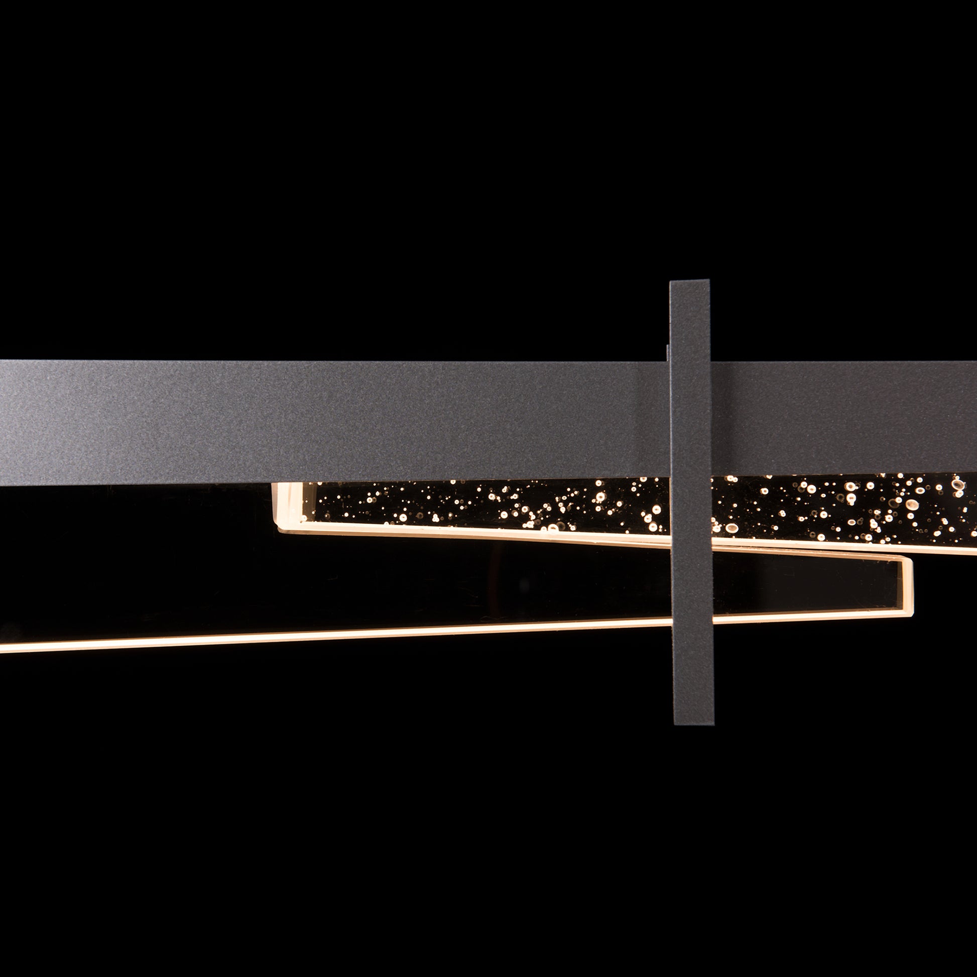 Hubbardton Forge Tenon LED Pendant in black metal and glass, showcasing rectangular shapes with bubble detailing.