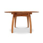 Vermont Modern Round Pedestal Extension Table, crafted from solid wood with a sleek surface and elegantly curved legs by Lyndon Furniture.