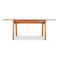 Lyndon Furniture Vermont Modern Extension Trestle Table in solid cherry, showcasing a sleek design.