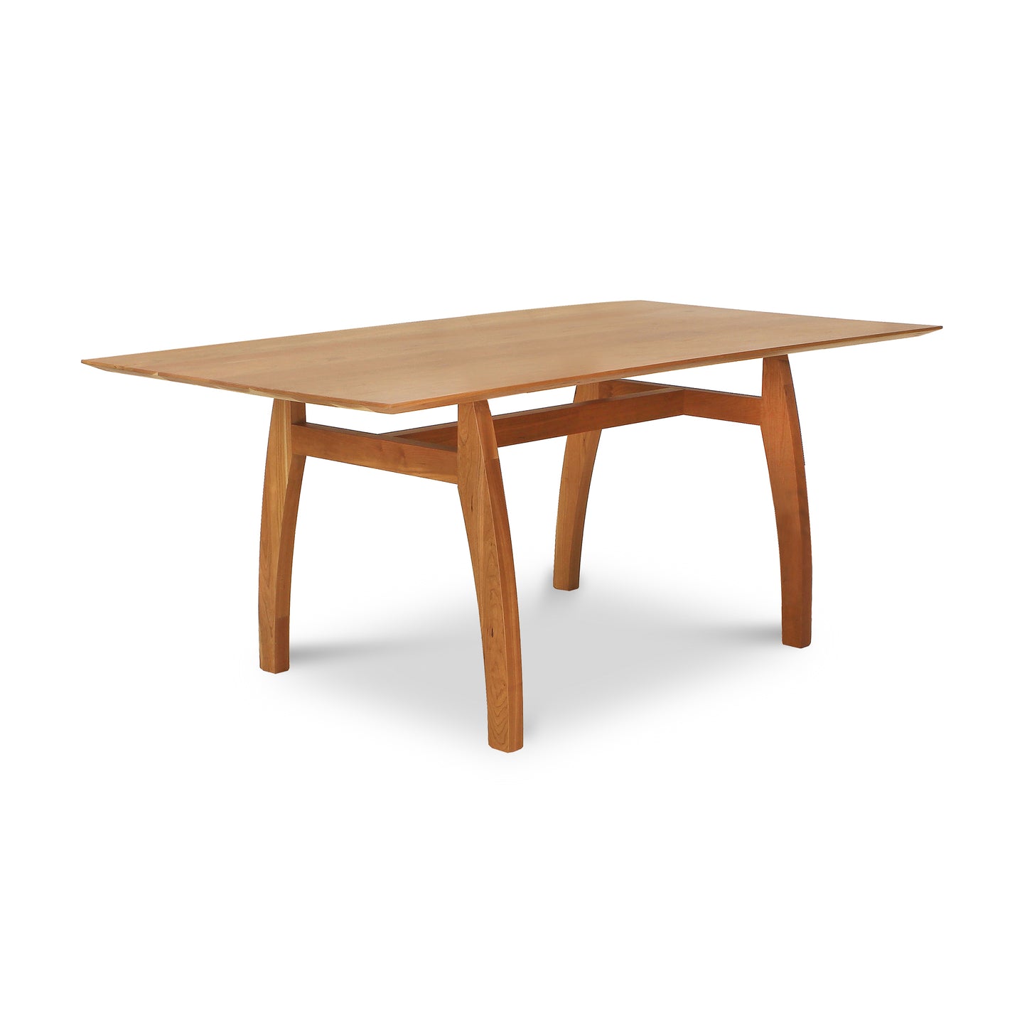 Vermont Modern Solid Top Trestle Table with a rectangular solid wood top and gracefully curved legs, expertly crafted by Lyndon Furniture.
