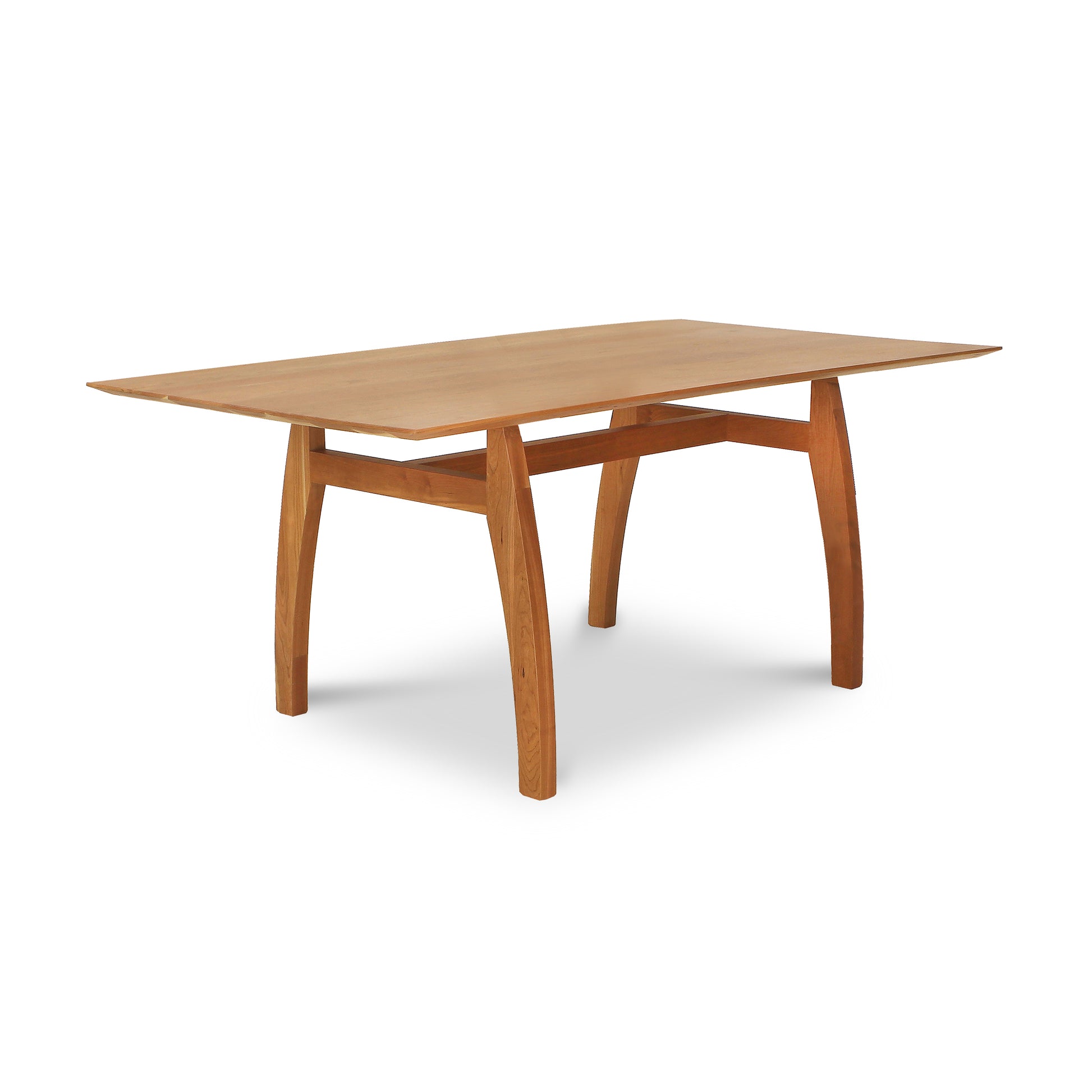 Vermont Modern Solid Top Trestle Table with a rectangular solid wood top and gracefully curved legs, expertly crafted by Lyndon Furniture.