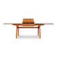 Vermont Modern Butterfly Extension Table by Lyndon Furniture, a sleek, extendable hardwood dining table with a contemporary design and smooth extension mechanism.