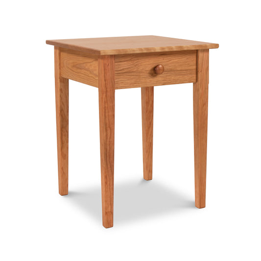 Vermont Shaker Bedside Table by Maple Corner Woodworks, featuring a square top, four sturdy legs, and a single drawer with a round knob, crafted from sustainably harvested solid woods.