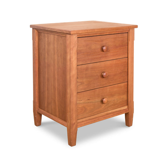 Vermont Shaker 3-Drawer Nightstand with round knobs and natural finish, crafted from eco-friendly wood by Maple Corner Woodworks.