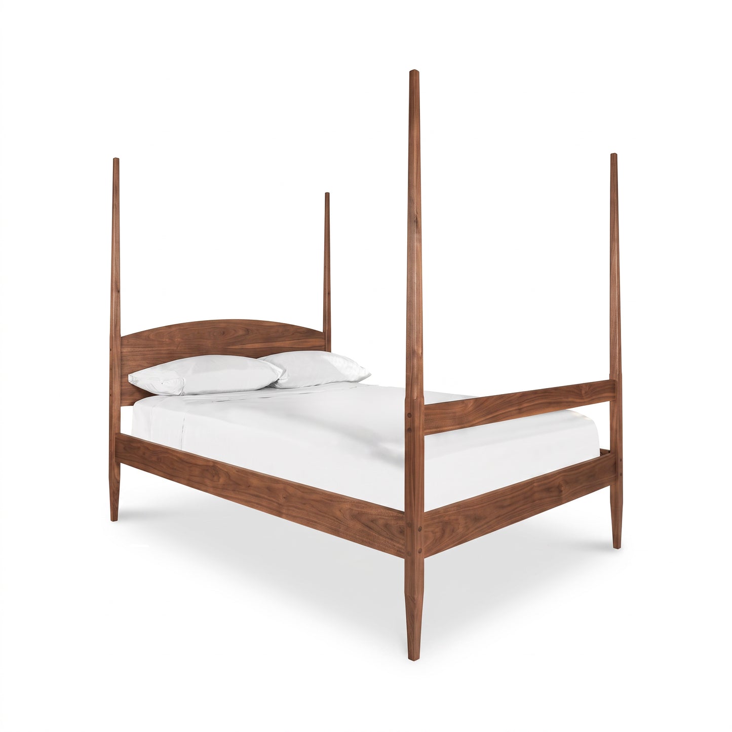Vermont Shaker Four Poster Bed by Maple Corner Woodworks showcasing solid wood walnut construction with tall, pointed posts.