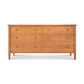 Vermont Shaker 6-Drawer Dresser by Maple Corner Woodworks with round knobs, solid wood construction, natural finish, and four tapered legs.