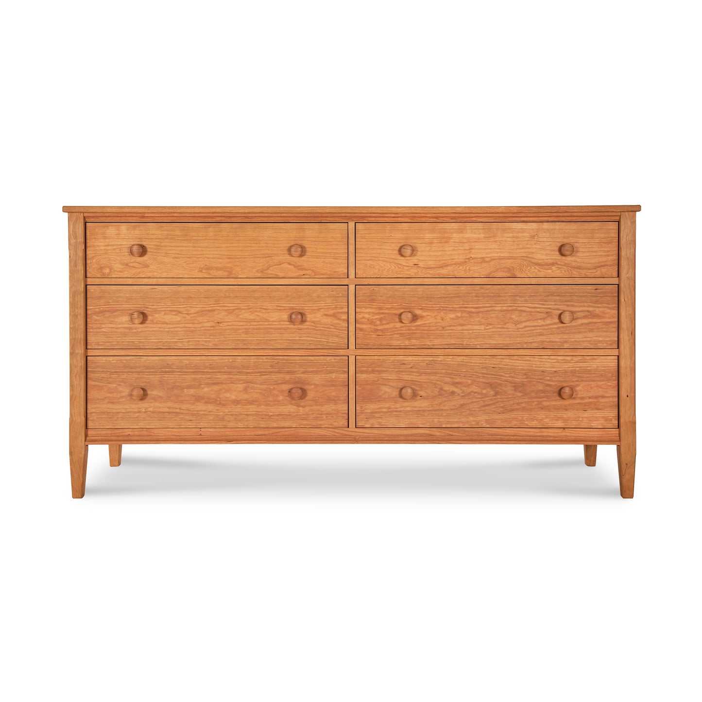 Vermont Shaker 6-Drawer Dresser by Maple Corner Woodworks with round knobs, solid wood construction, natural finish, and four tapered legs.