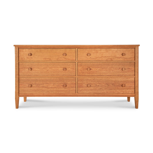 Vermont Shaker 6-Drawer Dresser by Maple Corner Woodworks with round knobs, solid wood construction, natural finish, and four tapered legs.