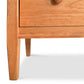Maple Corner Woodworks Gomella Vermont Shaker 7 Drawer Dresser in natural wood, featuring a detailed view of the drawer, round handle, and classic legs.
