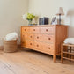 Vermont Shaker 7-Drawer Dresser by Maple Corner Woodworks, crafted in solid wood, shown with minimal decor displayed on its surface.