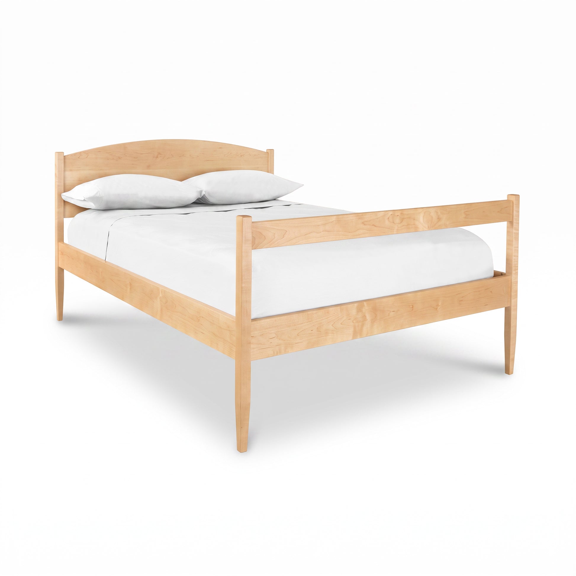 Vermont Shaker Bed by Maple Corner Woodworks featuring underbed storage, crafted in solid wood with white bedding and two pillows.