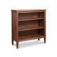 Vermont Shaker Bookcase by Maple Corner Woodworks features three shelves, tapered legs, and is crafted from sustainably harvested hardwoods.