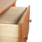 Vermont Shaker 2-Drawer Lateral File Cabinet by Maple Corner Woodworks, crafted from solid wood, featuring round handles and drawers partially open to show interior.