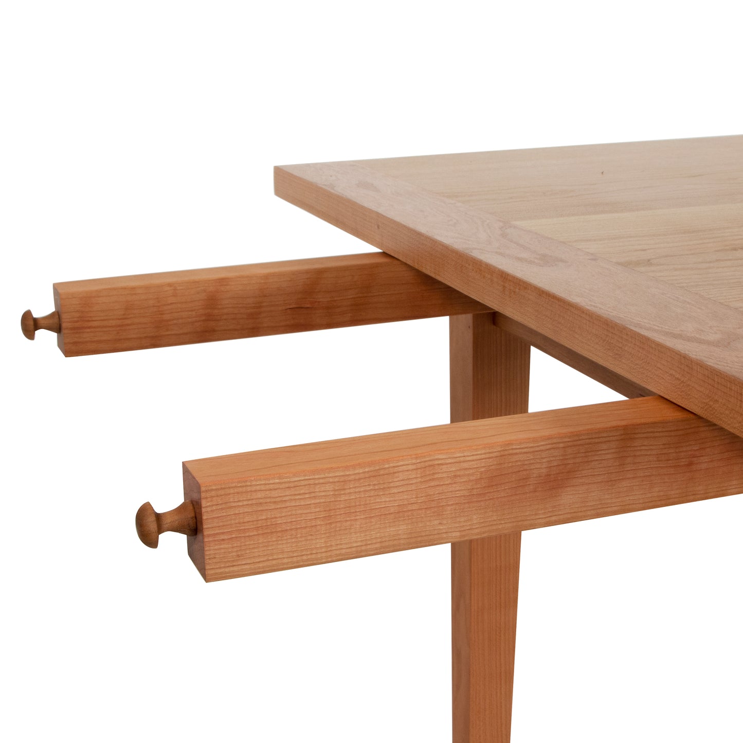 Vermont Shaker Harvest Extension Dining Table by Maple Corner Woodworks, crafted in solid wood with two drawers discreetly beneath the tabletop.