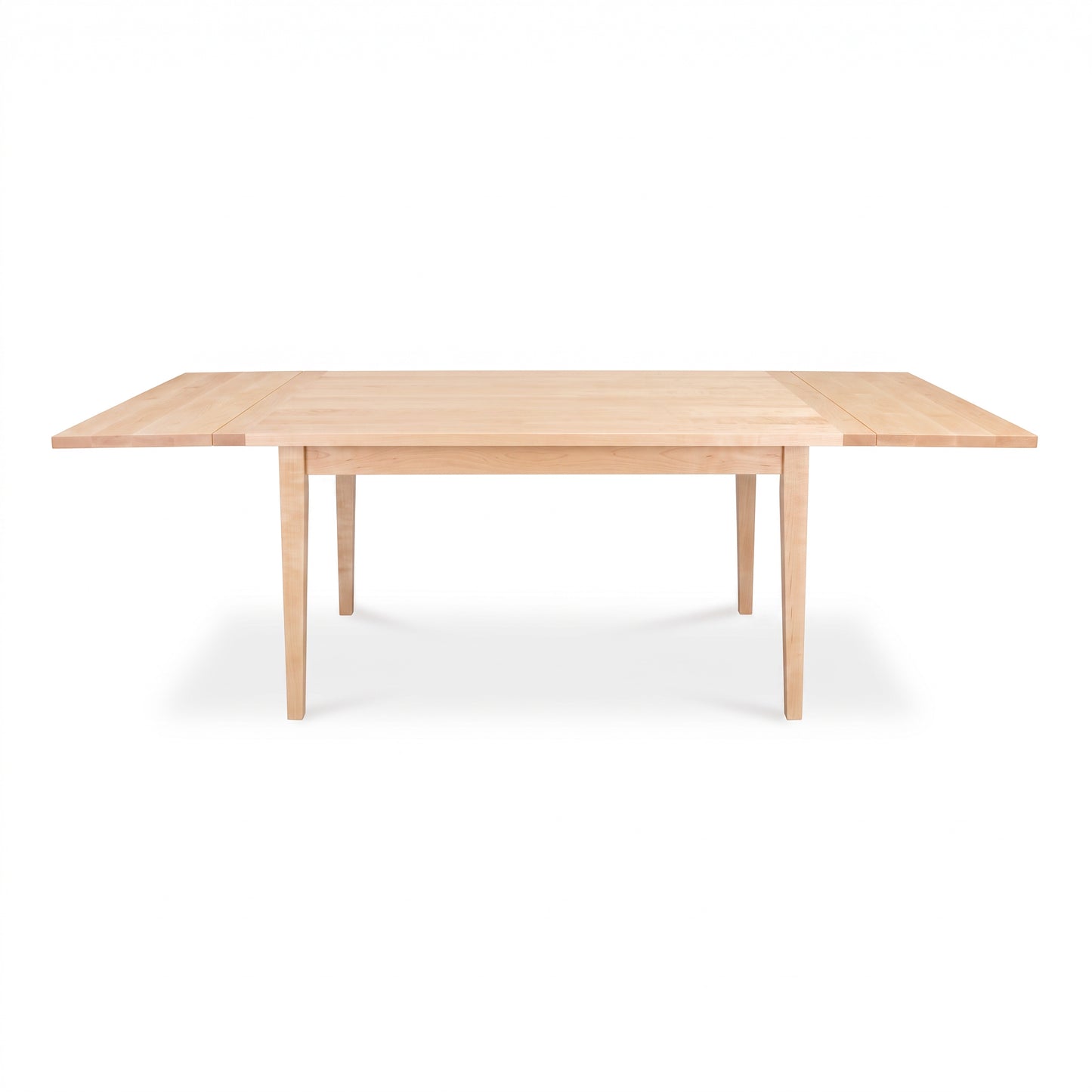 Rectangular Vermont Shaker Harvest Extension Dining Table by Maple Corner Woodworks in a light finish, showcasing handcrafted American craftsmanship.