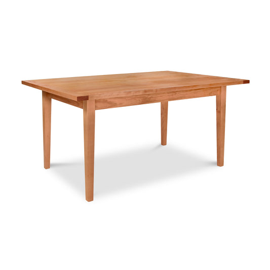 Vermont Shaker Harvest Extension Dining Table by Maple Corner Woodworks features classic straight legs and beautiful wood craftsmanship.