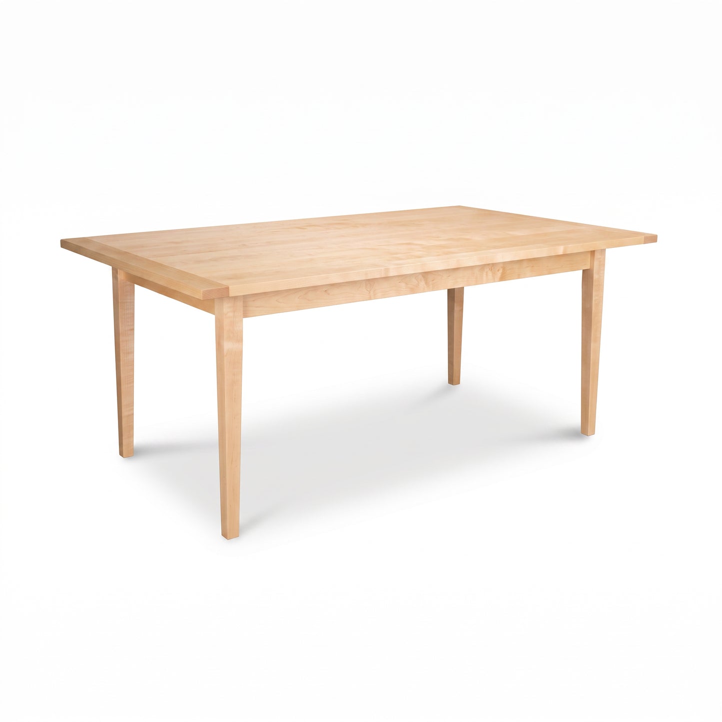 Vermont Shaker Solid Top Harvest Table by Maple Corner Woodworks, handcrafted from solid maple wood with four legs, showcasing elegant American-made design.