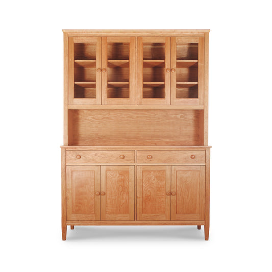 Vermont Shaker Large China Cabinet by Maple Corner Woodworks, crafted from natural cherry hardwood, featuring glass-paneled upper cabinets with lower drawers and cupboard doors.
