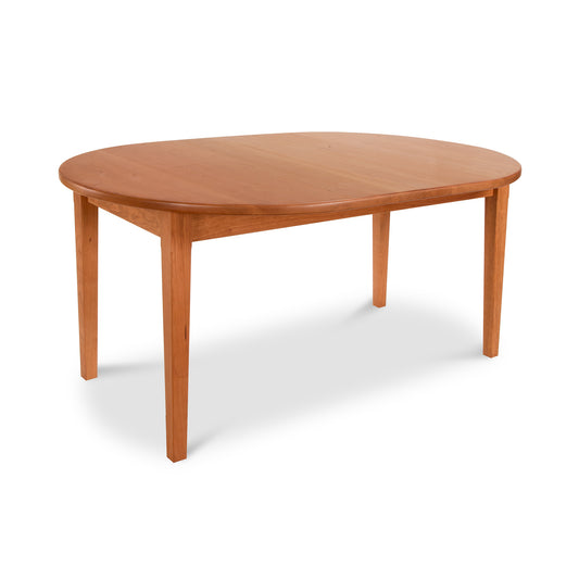 Oval Vermont Shaker Oval Solid Top Dining Table by Maple Corner Woodworks with four-leg design, crafted from sustainably harvested wood, highlighting the timeless elegance of Vermont Shaker Furniture.