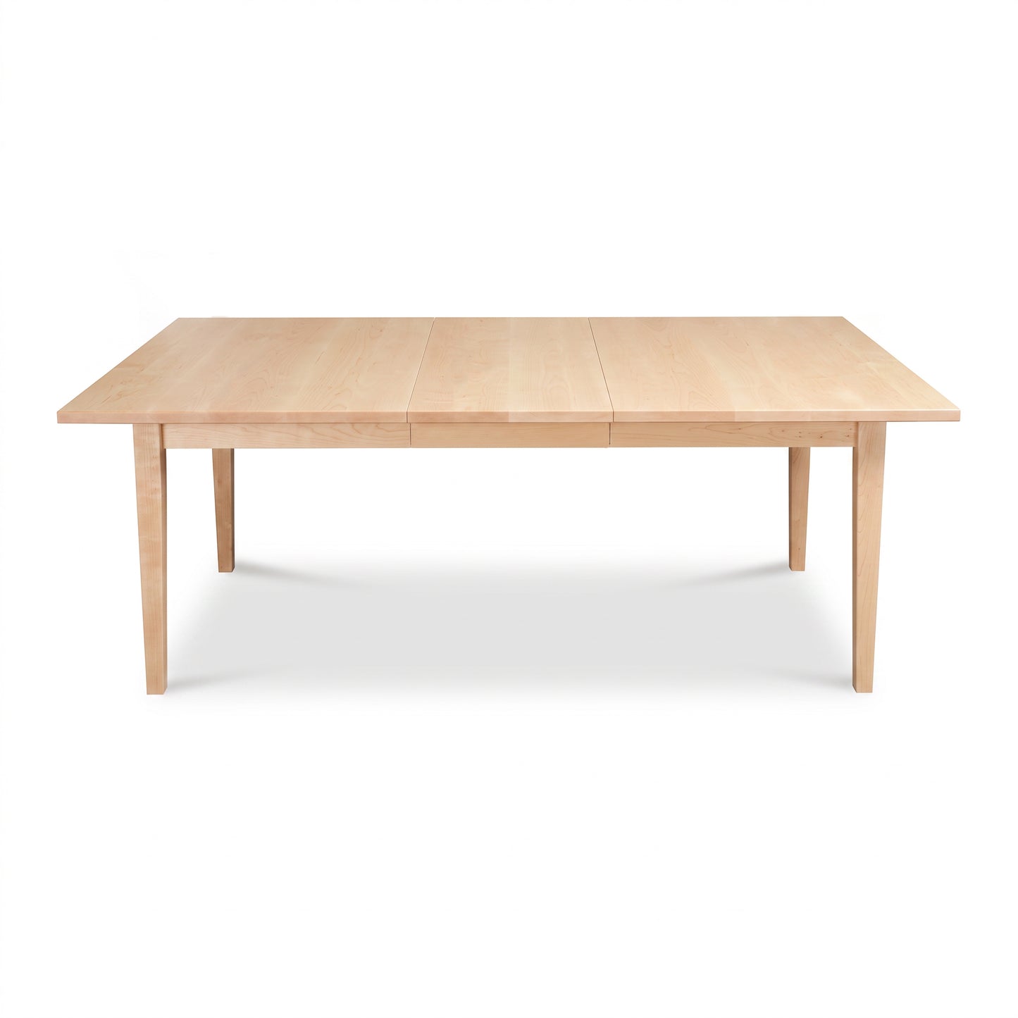 Vermont Shaker Rectangular Extension Dining Table by Maple Corner Woodworks with center seam and four legs, crafted in solid wood.
