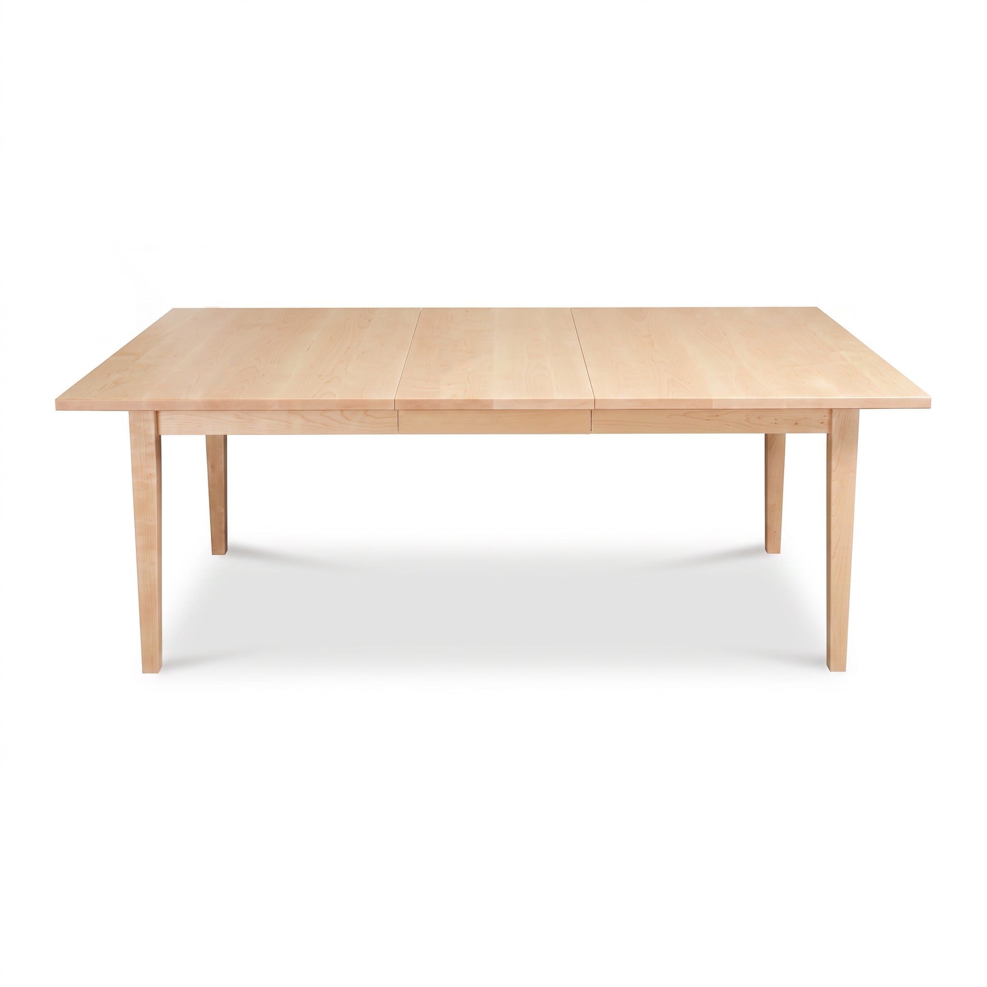 Vermont Shaker Rectangular Extension Dining Table by Maple Corner Woodworks with center seam and four legs, crafted in solid wood.