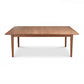 Maple Corner Woodworks Vermont Shaker Rectangular Extension Dining Table with four legs, crafted from solid wood, shown in a simple studio setting.