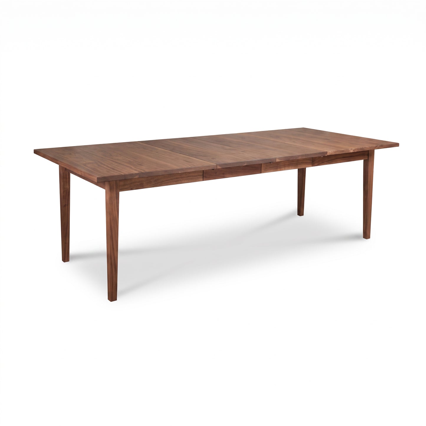 Vermont Shaker Dining Table by Maple Corner Woodworks with four sturdy legs and a natural wood finish, showcasing quality American craftsmanship.