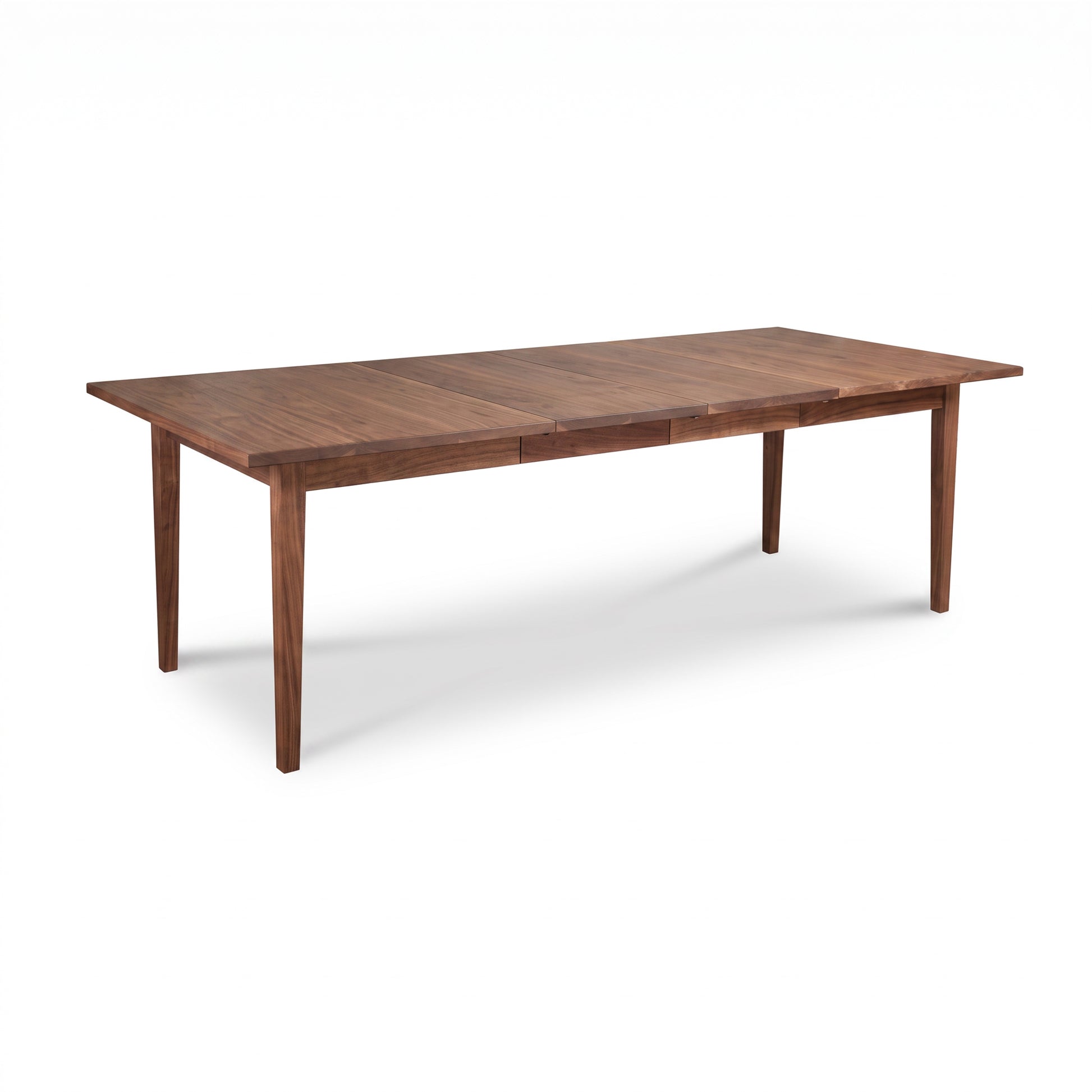 Vermont Shaker Dining Table by Maple Corner Woodworks with four sturdy legs and a natural wood finish, showcasing quality American craftsmanship.