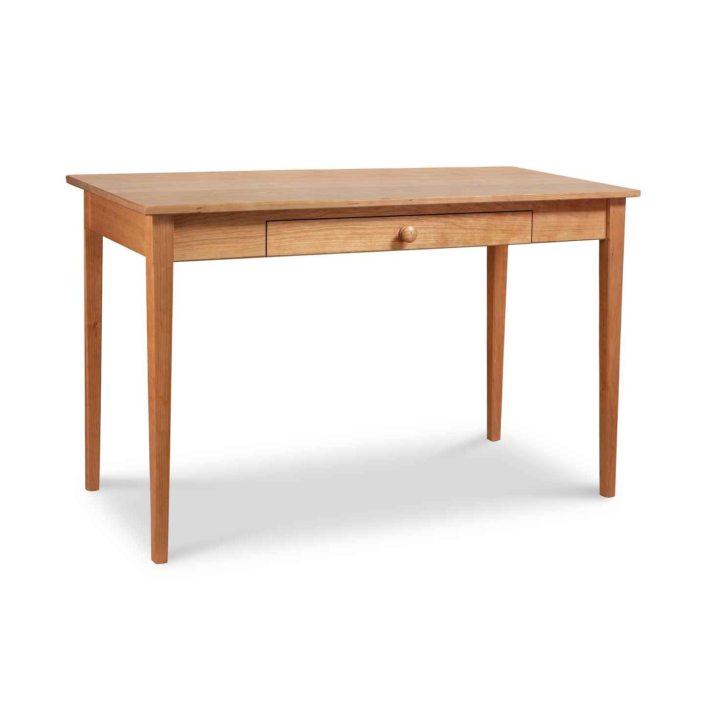 Vermont Shaker Writing Desk by Maple Corner Woodworks in solid wood with four legs, rectangular top, and a center drawer with knob.