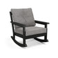 Cushioned gray POLYWOOD Vineyard Deep Seating Rocking Chair with black frame, eco-friendly design.