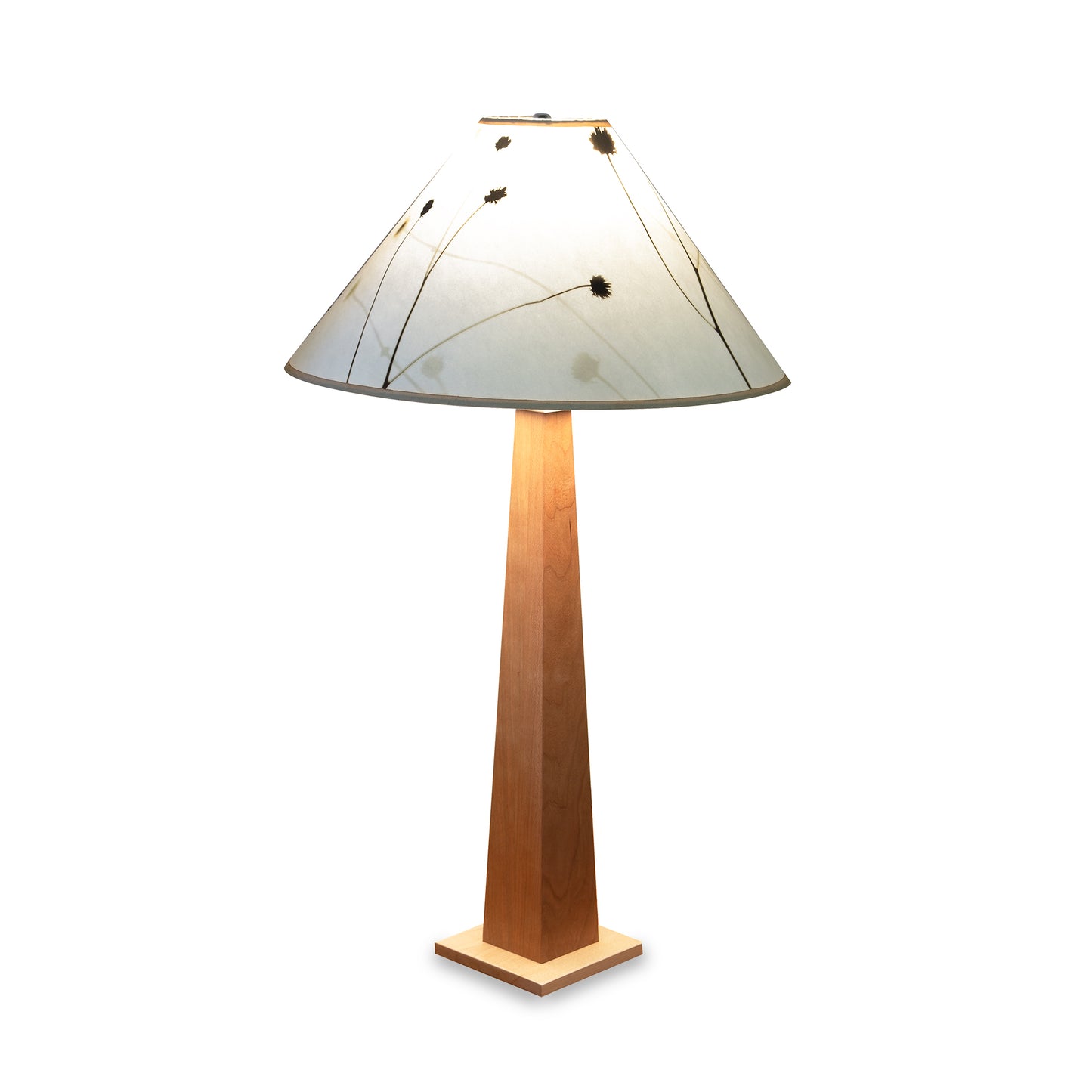 Winter Hill Table Lamp by Rock River Studio with natural maple accents and wide white shade featuring a plant silhouette.