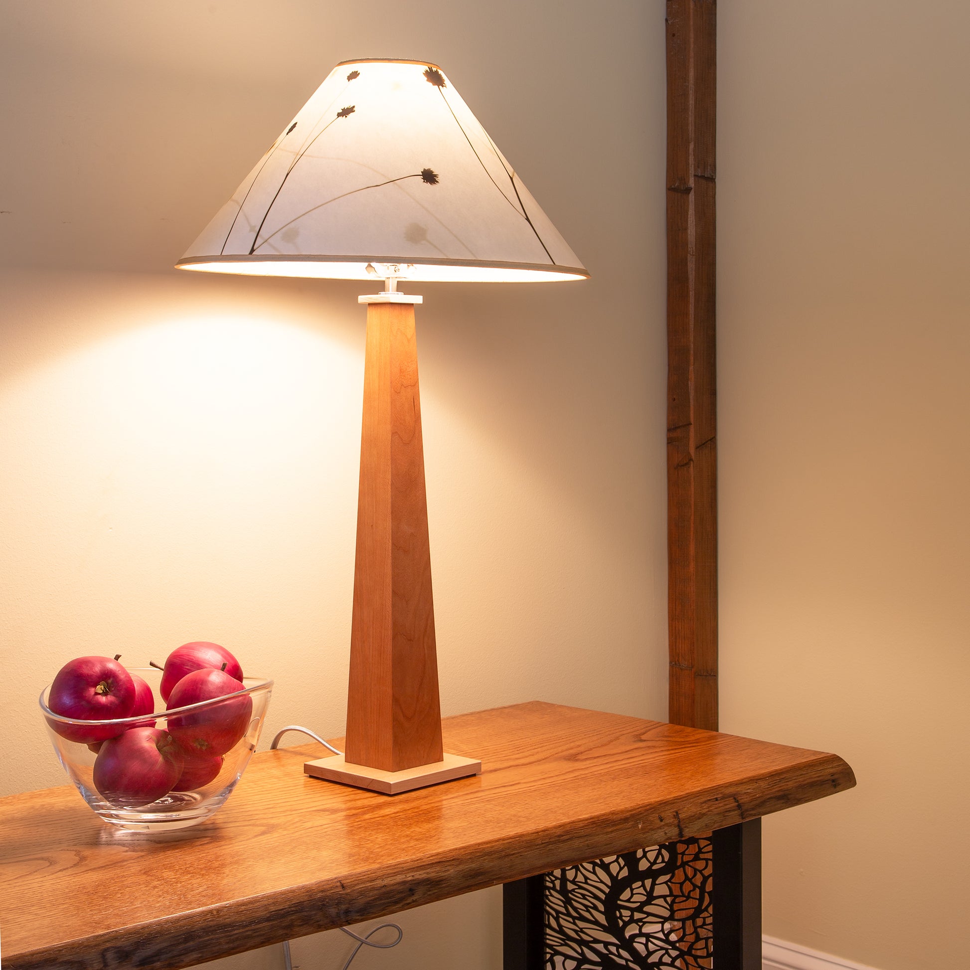 Winter Hill Table Lamp by Rock River Studio in hand-finished wood and glass, displayed on a tabletop.