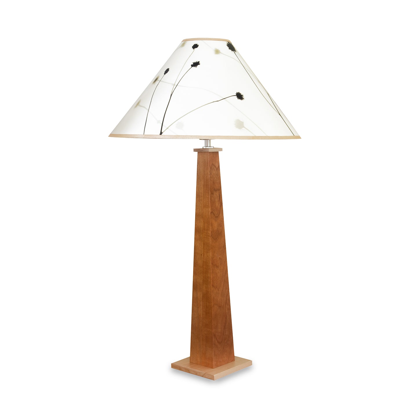 Winter Hill Table Lamp by Hubbardton Forge with a soft gold base and white anna shade featuring a black floral design, showcasing elegant American craftsmanship.