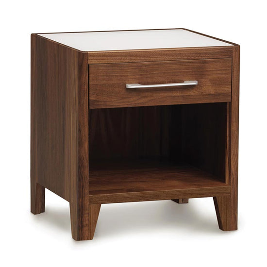A wooden nightstand with a drawer on top.