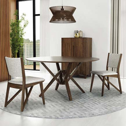 A modern dining room with a round table and chairs.
