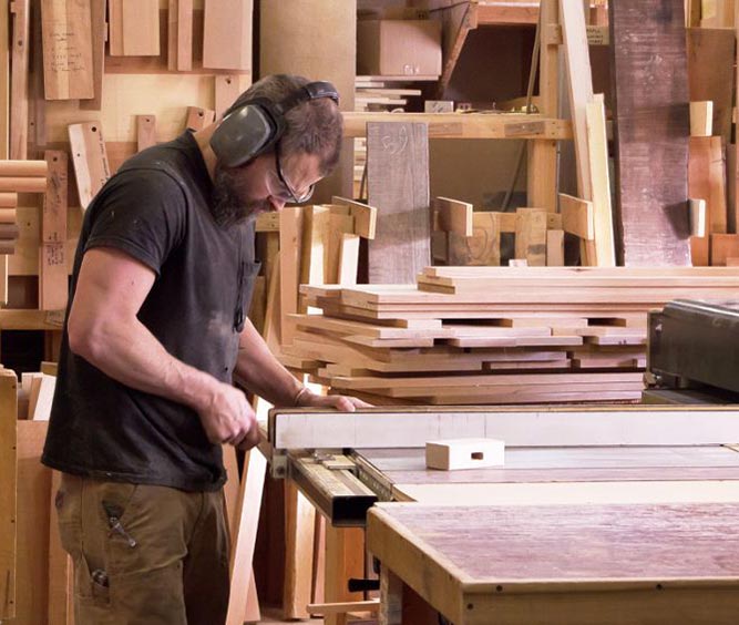 A man working in a wood shop.
