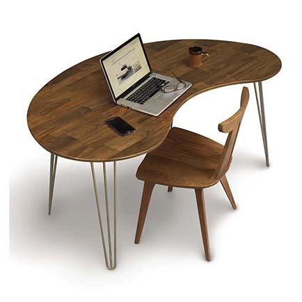 A wooden desk with a laptop and a chair.
