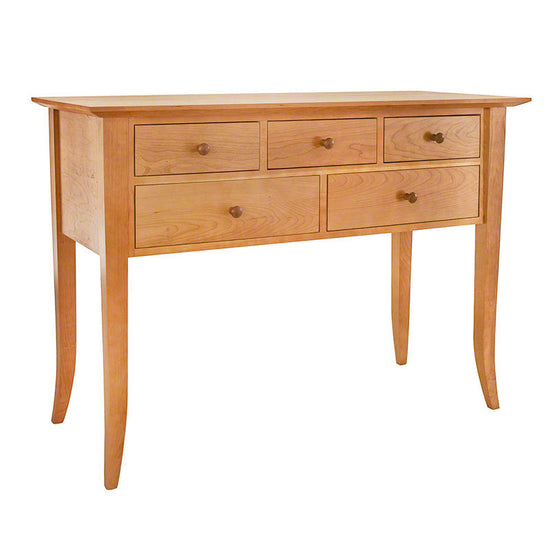 A wooden table with drawers.