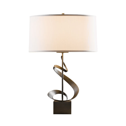 Gallery Spiral Table Lamp by Hubbardton Forge with a distinctive twisting ribbon design, shown in discontinued finish, available on clearance.