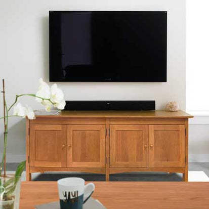 A living room with a tv and a coffee table.