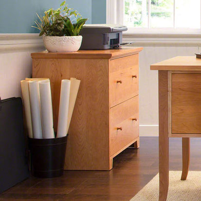 A home office with a desk and a chair.