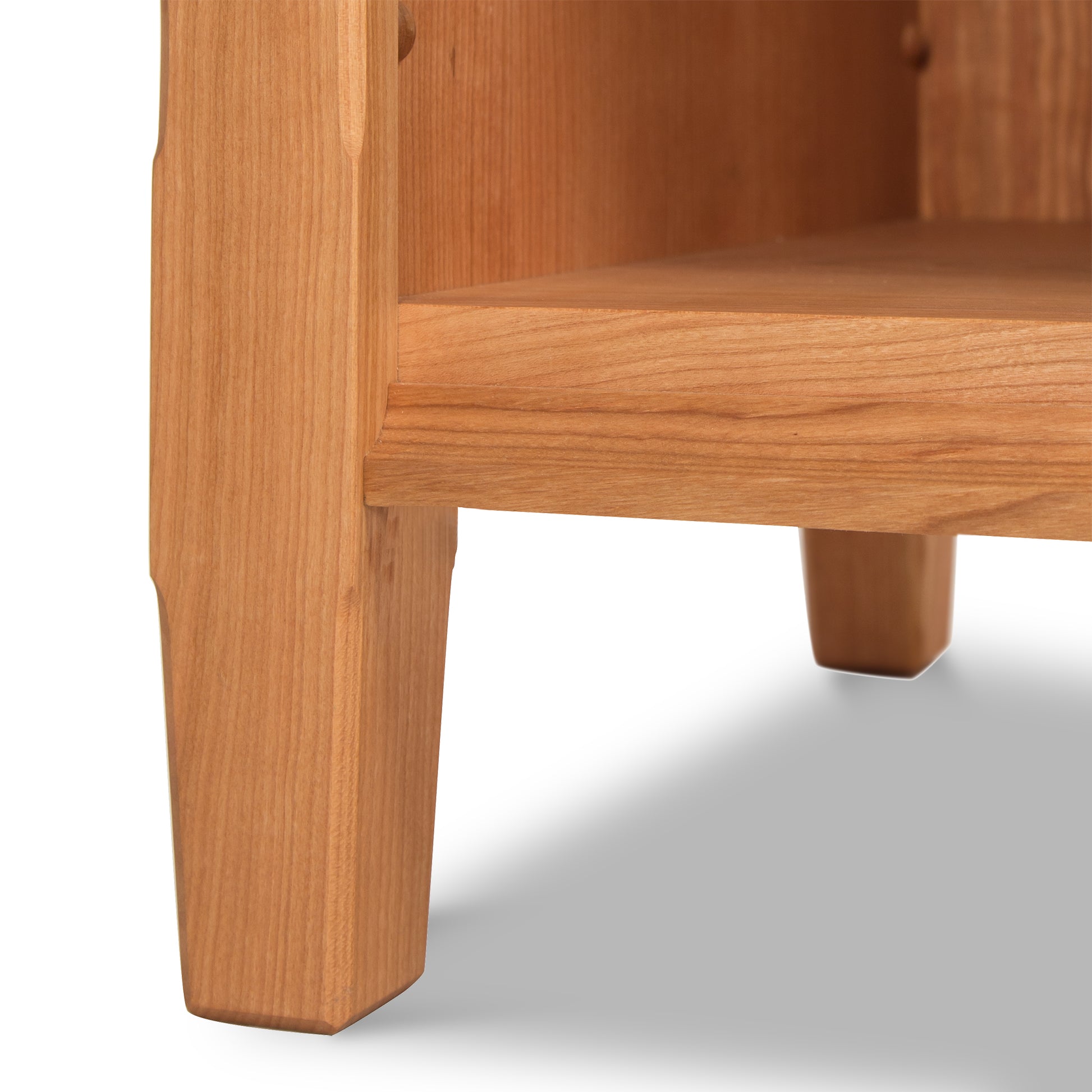 A close up view of a wooden shelf.